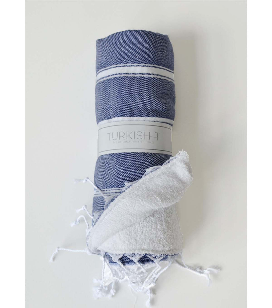 https://www.turkish-t.com/cdn/shop/products/TurkishTowel_Turkish-T_Basicbath_Navy_rolledterrylinedchildren_1100x.jpg?v=1669156249